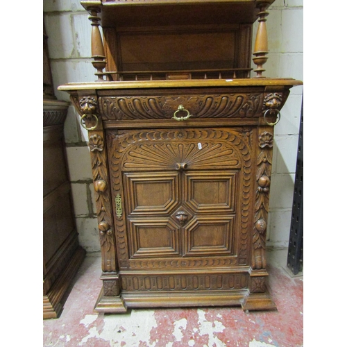 2649 - A 19th century oak pier cabinet, the lower section enclosed by a quarter panelled door and frieze dr... 