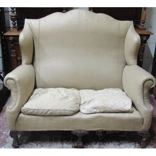 2651 - A good quality Edwardian two seat sofa frame with shaped outline, winged borders and scrolled arms r... 