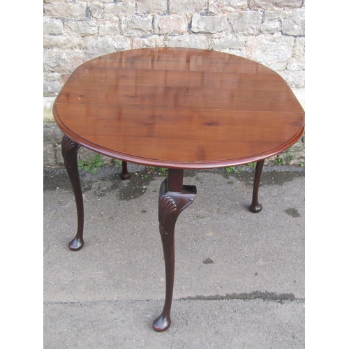 2657 - A Queen Ann style mahogany drop leaf table raised on four shaped supports with shell carved knees, 1... 