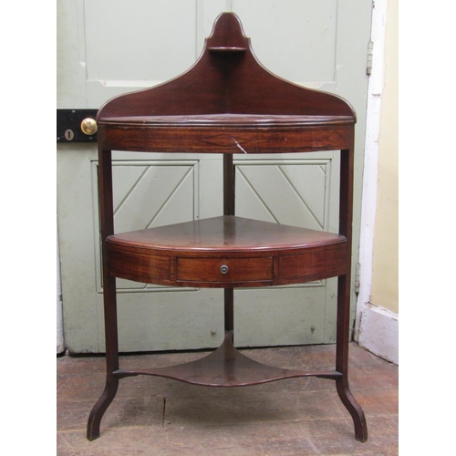 2711 - A Georgian mahogany corner washstand with single frieze drawer on shaped supports