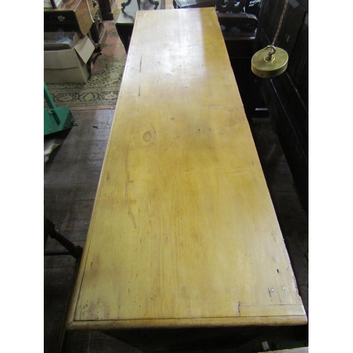 2721 - A 19th century stripped and waxed pine kitchen dresser base enclosed by three panelled doors and thr... 