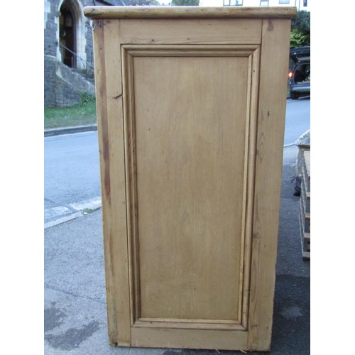 2721 - A 19th century stripped and waxed pine kitchen dresser base enclosed by three panelled doors and thr... 