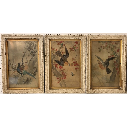 107 - Three framed Chinese paintings on silk of birds in trees (early 20th century), two bearing red seal ... 