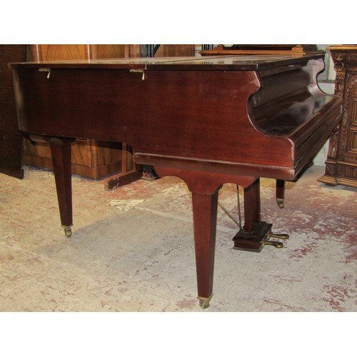 2652 - A Baby Grand Piano retailed by Duck Son & Pinker in a polished mahogany cased raised on three square... 