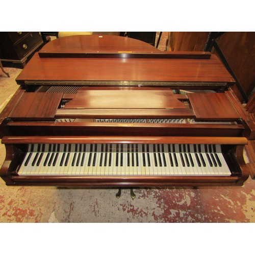 2652 - A Baby Grand Piano retailed by Duck Son & Pinker in a polished mahogany cased raised on three square... 