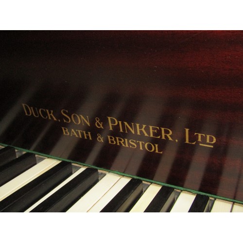 2652 - A Baby Grand Piano retailed by Duck Son & Pinker in a polished mahogany cased raised on three square... 