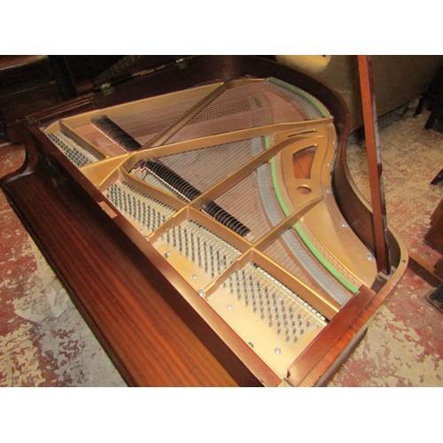 2652 - A Baby Grand Piano retailed by Duck Son & Pinker in a polished mahogany cased raised on three square... 