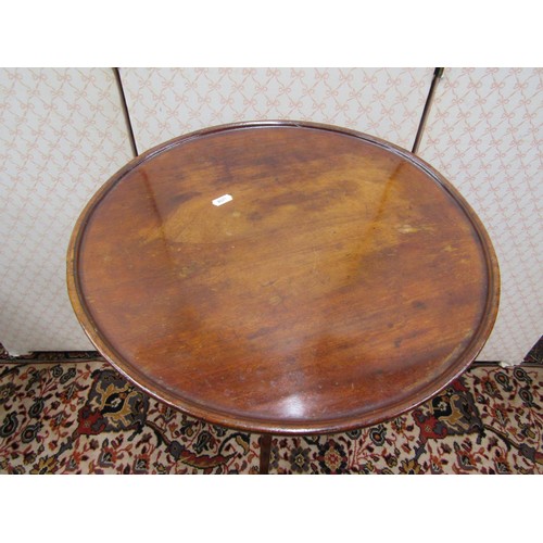 2733 - A dainty Georgian walnut dished top occasional table, the circular top 47cm diameter, raised on a sl... 