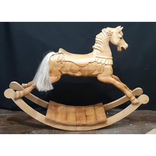 398 - Unusual carved pine rocking horse, made in Scotland 1990, with  carved mane and saddle, horsehair ta... 