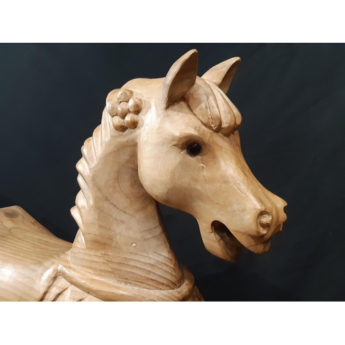 398 - Unusual carved pine rocking horse, made in Scotland 1990, with  carved mane and saddle, horsehair ta... 