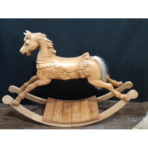 398 - Unusual carved pine rocking horse, made in Scotland 1990, with  carved mane and saddle, horsehair ta... 