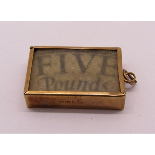 1359 - Two 9ct novelty charms comprising a lucky pixie and an 'In emergency break glass' five pound note ch... 