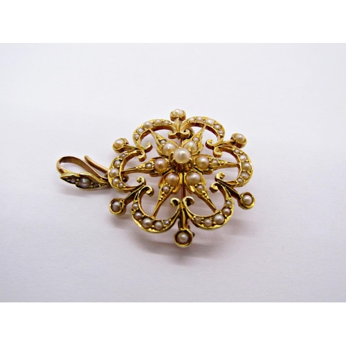 1369 - Edwardian 15ct flower head pendant / brooch set with seed pearls, 3.5cm L approx, 6.1g