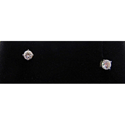 1402 - Pair of 9ct white gold diamond solitaire stud earrings with screw fastenings, each 0.15ct approx, st... 