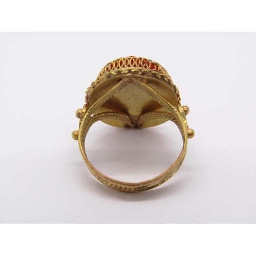 1421 - Ornate yellow metal ring set with a coral cameo depicting a lady in profile, size G, 4.9g