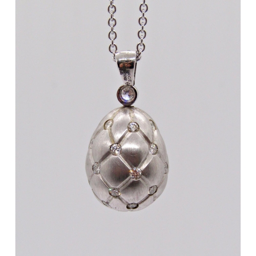 1422 - Fabergé Treillage 18ct white gold egg pendant necklace, the diamond set pendant with quilted finish,... 