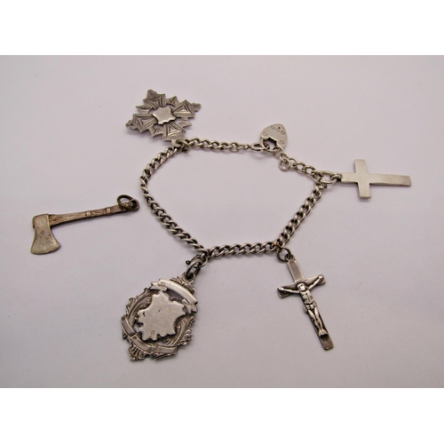 1428 - Group of silver comprising a 1940s engine turned compact, bracelet hung with two medal fobs and two ... 