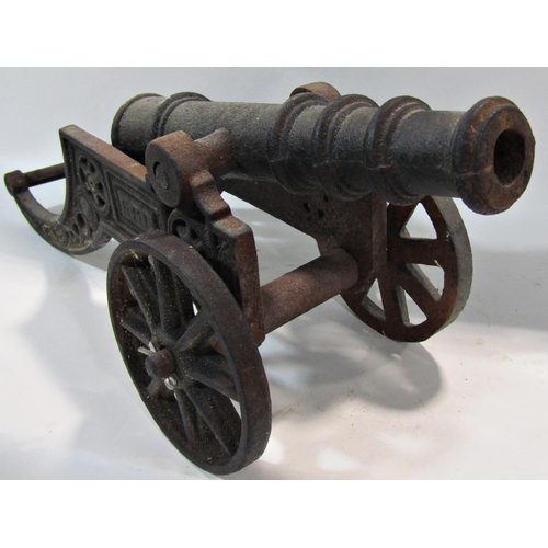 1728 - A 19th century cast iron miniature field canon 48cm wide.