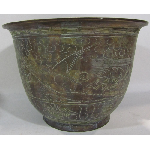 1729 - A brass eastern jardiniere with intricate floral decoration, 26cm diam.