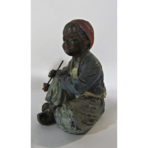 1730 - An Austrian 19th century cold painted Arab boy smoking a pipe, 8cm tall.