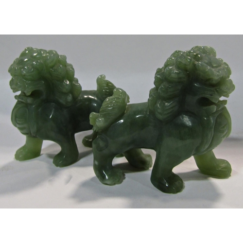 1732 - A pair of Chinese green jade lions, 7.5cm x 7cm high.