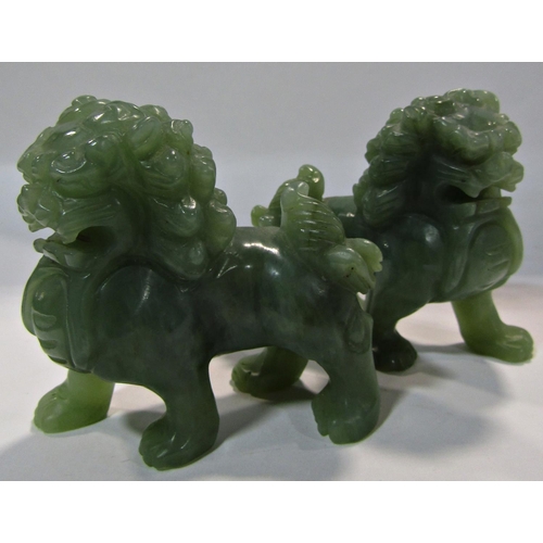 1732 - A pair of Chinese green jade lions, 7.5cm x 7cm high.