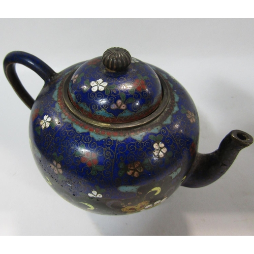 1742 - A small Japanese cloisonné round teapot with overall floral decoration on a tripod base. 10.5cm high... 