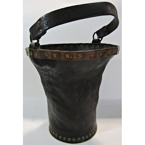 1795 - An antique 19th century leather and brass fire bucket complete with leather handle, 25cm diameter x ... 