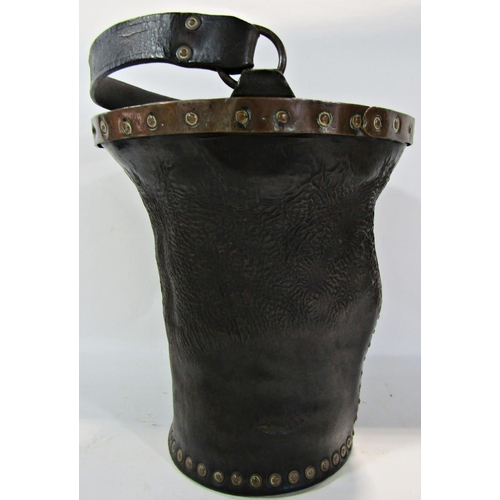 1795 - An antique 19th century leather and brass fire bucket complete with leather handle, 25cm diameter x ... 