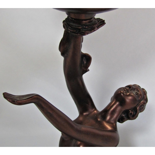 1749 - An Art Deco style bronze effect table lamp of a posing dancing girl holding aloft a globular lamp, 2... 