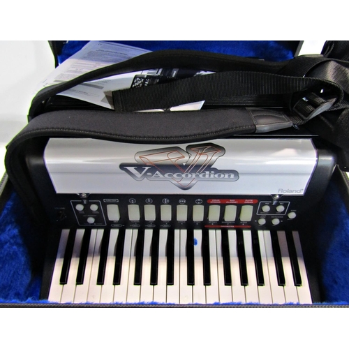 1812 - A Roland V. electric Accordion in original carrying case