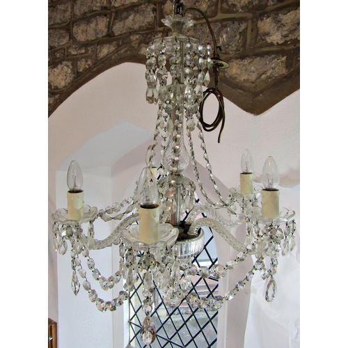 1822 - A Regency style five branch crystal chandelier with glass droplets.