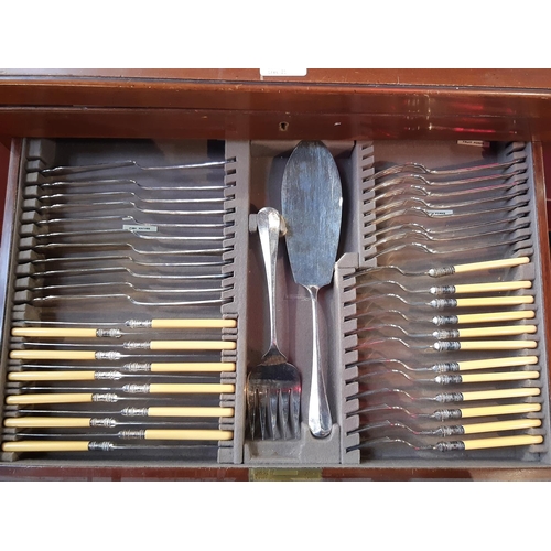 1255A - A canteen of cutlery containing mainly Goldsmiths and Silversmiths silver flatware, 11 main forks, 7... 