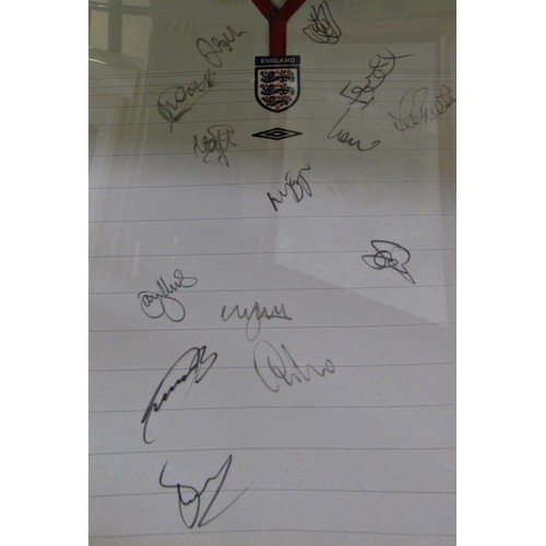 128A - England Football Shirt for 2004, signed by team members, in wooden and gilt frame