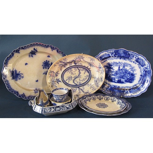 1124 - A collection of 19th century and other blue and white transfer printed ware to include graduated mea... 