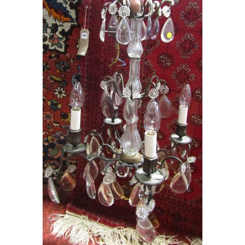 1828 - A three tier wrought iron 19th century style chandelier with four sconces, decorated with large tear... 