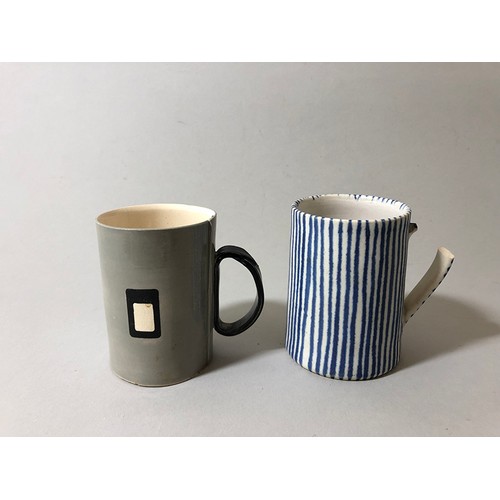 204 - Collection of mugs, saucers and a bowl to include: Sue Binn - blue stripe glazed mug; 'AM' marked mo... 