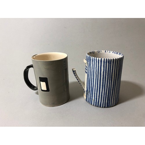 204 - Collection of mugs, saucers and a bowl to include: Sue Binn - blue stripe glazed mug; 'AM' marked mo... 