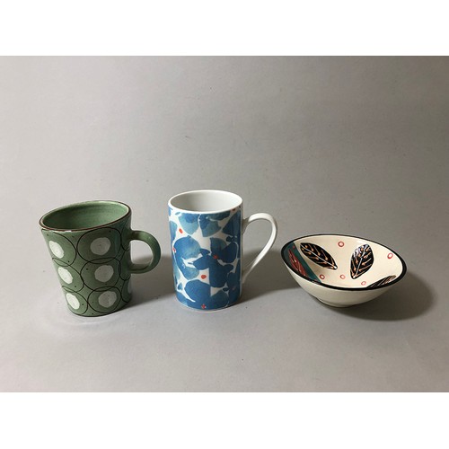 204 - Collection of mugs, saucers and a bowl to include: Sue Binn - blue stripe glazed mug; 'AM' marked mo... 