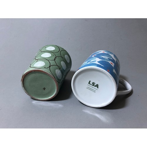 204 - Collection of mugs, saucers and a bowl to include: Sue Binn - blue stripe glazed mug; 'AM' marked mo... 