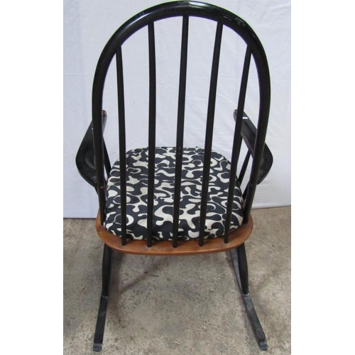 217 - MANNER OF IIMARI TAPIOVAARA: A BLACK PAINTED ROCKING CHAIR, 107cm H x 84cm D x 66cm W