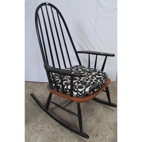 217 - MANNER OF IIMARI TAPIOVAARA: A BLACK PAINTED ROCKING CHAIR, 107cm H x 84cm D x 66cm W