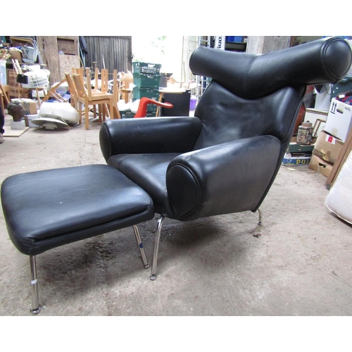 218 - AFTER HANS J WEGNER: A BLACK LEATHER “OX” LOUNGE CHAIR AND FOOTSTOOL, chair (102cm H x 102cm W x 79c... 