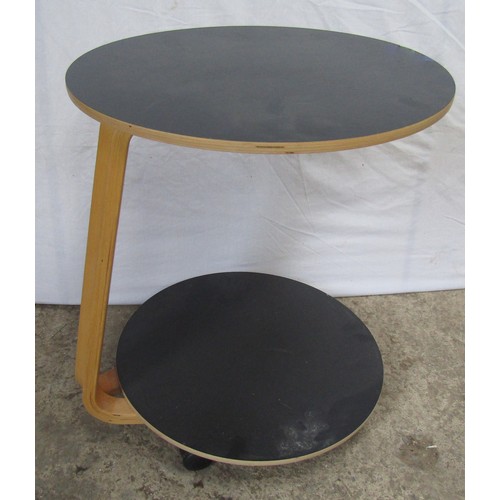 219 - IKEA: AN “ANES” TWO-TIER OCCASIONAL TABLE, raised on castors 57cm H x 49cm D