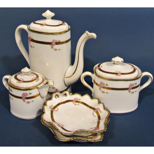 1010 - A continental porcelain coffee set with trailing pink floral swags within gilt borders