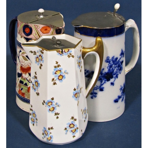 1019 - A large collection of blue and white transfer ware and relief moulded jugs, some with pewter covers,... 