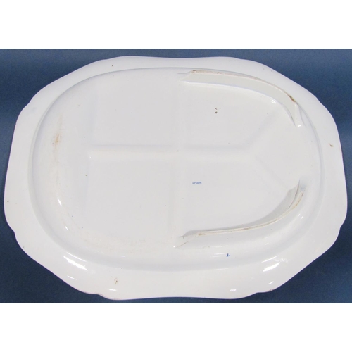 1025 - A substantial blue and white transfer printed meat plate with gravy well and drainer, the central pa... 