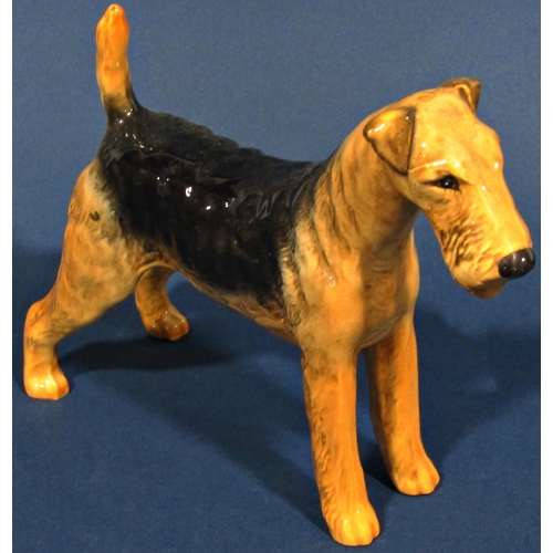 1077 - Three Beswick dogs, Staffordshire Bull Terrier, Airedale and a Retriever (Airedale af)