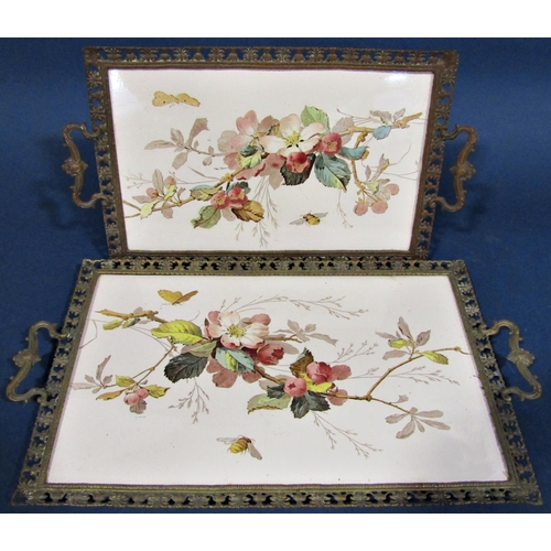 1082 - A pair of 19th century continental graduated porcelain rectangular trays, set within brass mounts wi... 