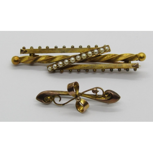 1312 - Two antique gold brooches; a 15ct example set with a row of eleven seed pearls, 2.8g and a further b... 